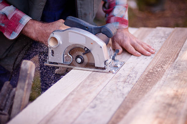 istock Man cutting wood with circular saw 526223891
