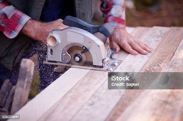 Man Cutting Wood With Circular Saw Stock Photo - Download Image Now - Chopping Food, Sawdust, Wood - Material