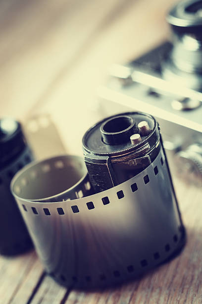 istock Old photo film rolls, cassette and retro camera on background. 526223975