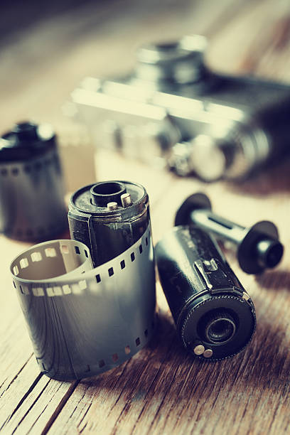 istock Old photo film rolls, cassette and retro camera. 526223979