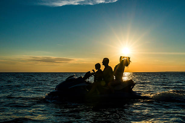 istock Family Riding a Jet Boat at Sunset 526224231