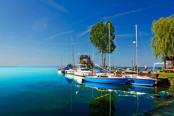 Summer scene with sail boats moored in marina in Sułomino, Szczecin Lagoon, Poland