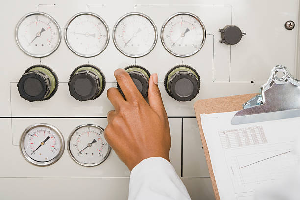 istock Hand Turning Dial in Medical Lab 526224655