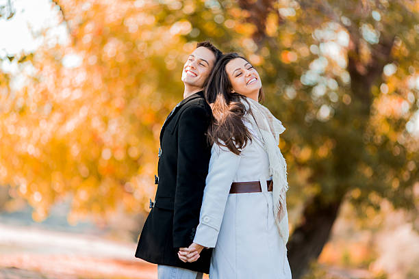istock Young couple in the autumn park 526225751