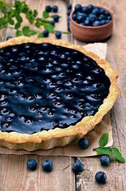 istock Blueberry pie on wooden table 526225827