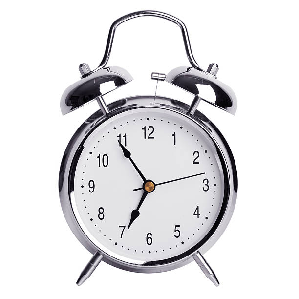 istock Five minutes to seven on a round alarm clock 526227243