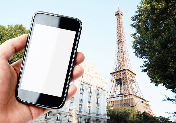 istock Hand holding smartphone with Paris city view 526227419