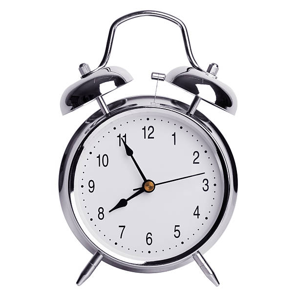 istock Five minutes to eight on a round alarm clock 526228309