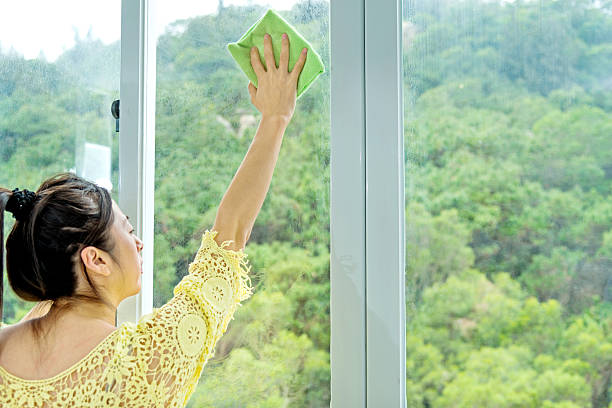 istock Woman cleaning window 526232789
