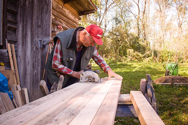 istock Man cutting wood with circular saw 526233709