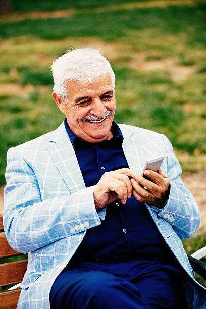 istock Grandfather with a phone 526235223