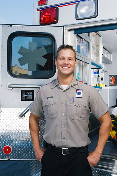 istock Paramedic outside ambulance, portrait 526235473