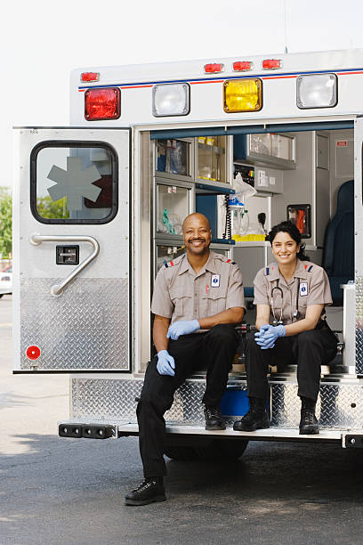 istock Two paramedics sitting in ambulance, portrait 526235497
