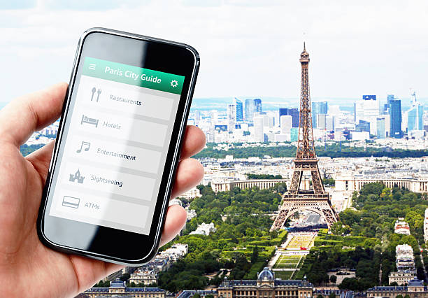 istock Hand holding smartphone with city guide in Paris 526236579
