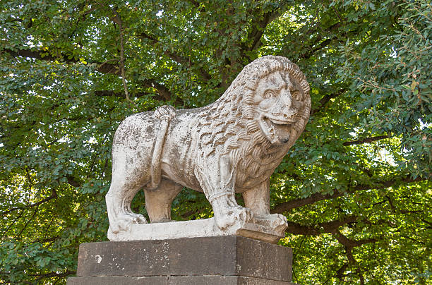 istock Ancient lion statue in Lucca, Italy 526238003