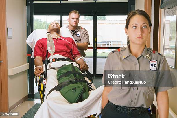 Paramedics Bringing Patient On Stretcher Into Hospital Stock Photo - Download Image Now