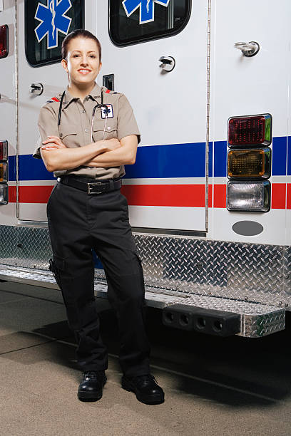 istock Paramedic in front of ambulance, portrait 526239313