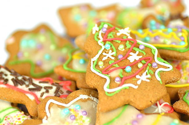 istock Delicious decorated Christmas cookies on white background 526240221