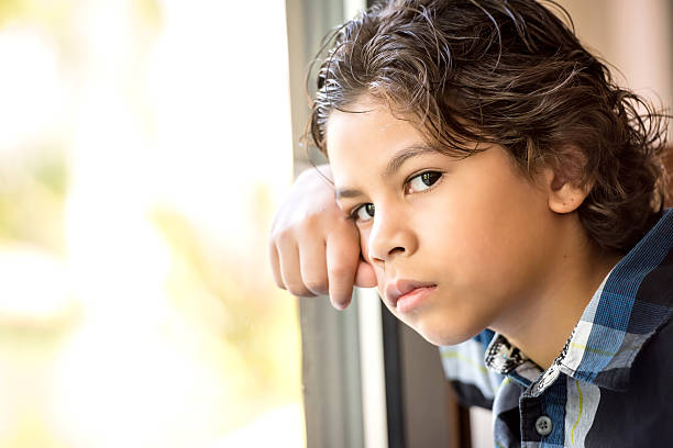 istock An image of a pensive little boy looking at the camera 526240573