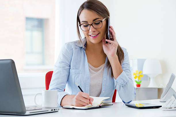 istock Pretty young woman working in her office. 526244199