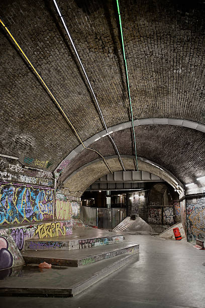 istock Gritty urban skate park under railway bridge 526244481