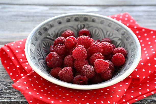 istock Raspberries in a bowl on napkin 526245151
