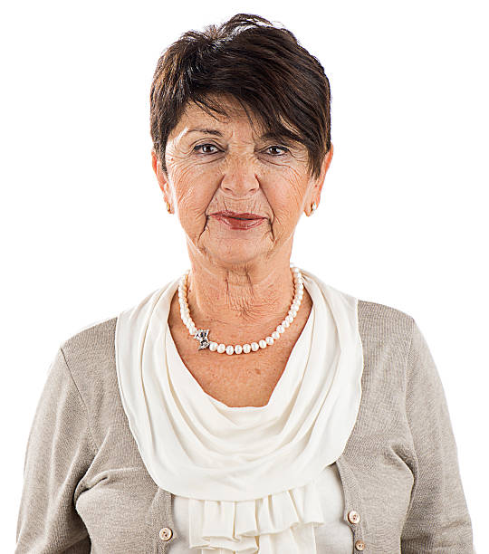 Outdoor portrait of a senior woman looking at the camera