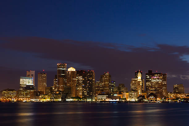 istock Boston skyline by night from East Boston, Massachusetts  - USA 526248437