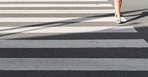 istock Person walking on a zebra crossing 526248853