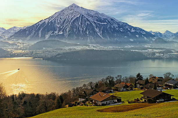 Thun lake view in winter Thun lake view in winter with reflected sunlight thun interlaken winter switzerland stock pictures, royalty-free photos & images