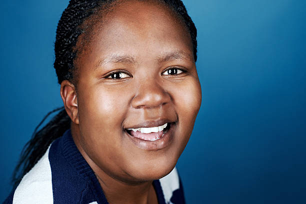 istock smiling african woman 526260313