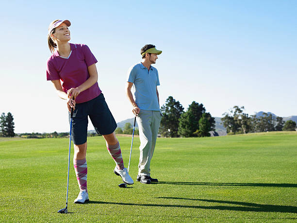 istock Woman Playing Golf With Male Friend 526269059