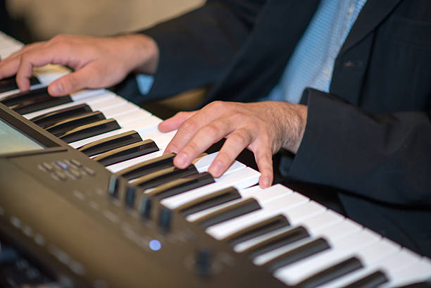 istock Male hands playing the piano 526269335