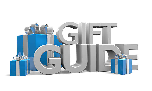 istock Gift guide text and three Christmas gifts wrapped in ribbons 526269669