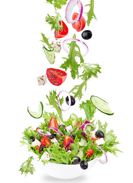 istock Fresh salad with flying vegetables ingredients 526269827