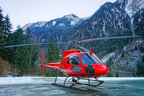 istock Red helicopter on the base in swiss alps 526271681
