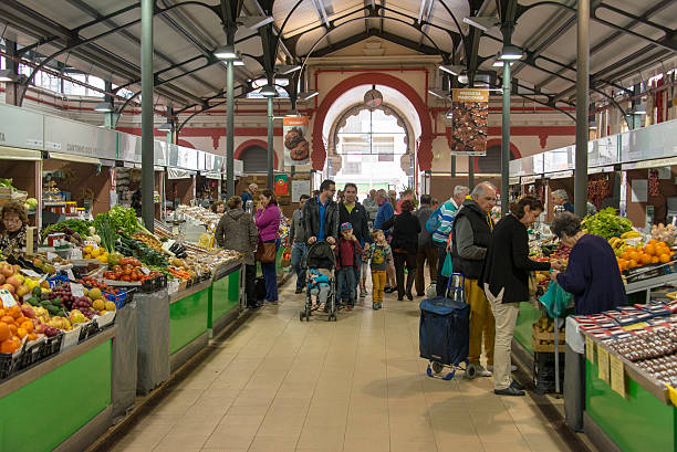 Loulé,Portugal - April 2, 2016: People shopping at the indoor fruit, vegetable, meat and fish market in the town centre.