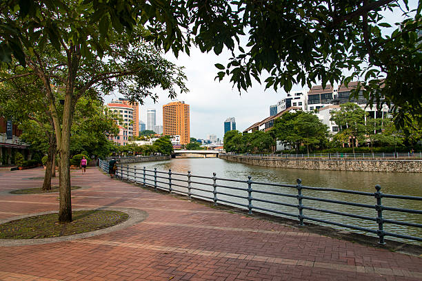 Singapore, Singapore - April 10, 2016: View at a Robertson Quay street beside the Singapore River in the heart of Singapore during a warm but cloudy day. In Robertson Quay crowds of tourists, locals and expats enjoying the many bars and restaurants.