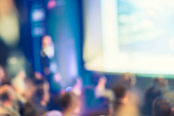 istock Large Group of People Listening to a Presentation 526272770