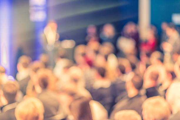 istock Large Group of People Listening to a Presentation 526272944