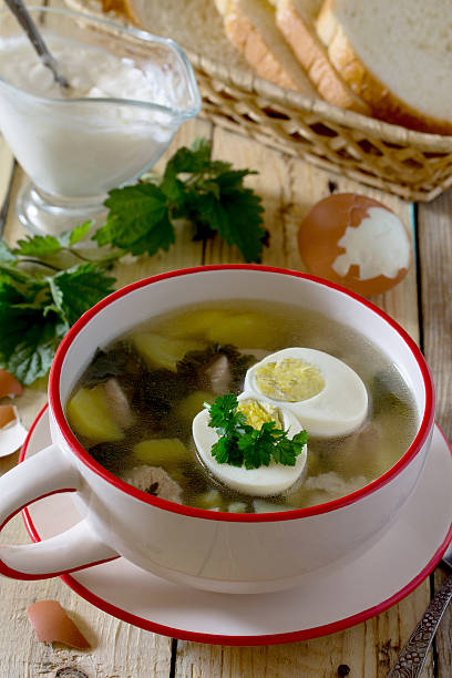 istock Soup of young nettle with egg and sour cream 526273188
