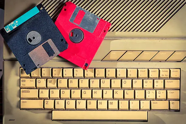 Photo of Vintage floppy disks and keyboard