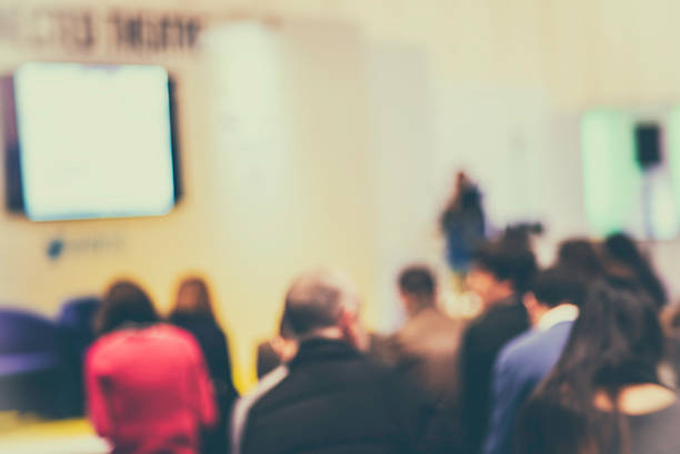 istock Large Group of People Listening to a Presentation 526275222