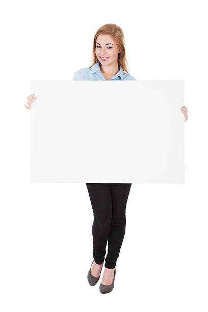 istock Smiling Woman Holding Placard 526275453