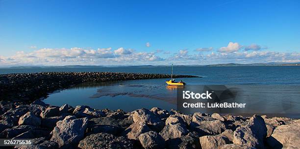 Small Yellow Boat In Dock At Low Tide Stock Photo - Download Image Now - Morecambe, Beach, Coastline