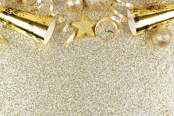 istock New Years Eve border on shiny gold background 526276817