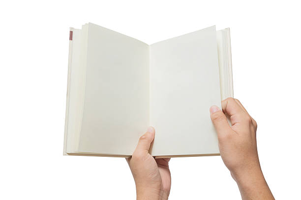 istock Hand holding white book isolated on white 526276908