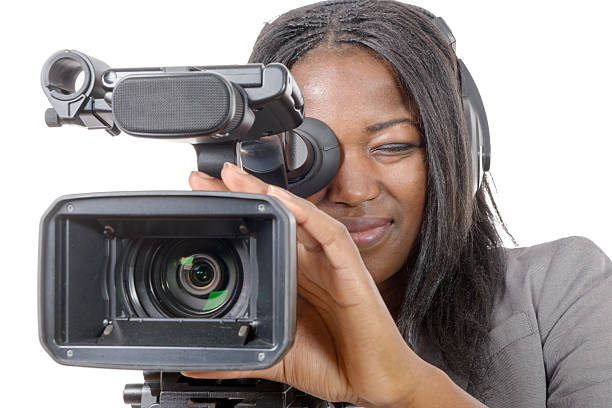 istock young African American women with professional video camera 526276984
