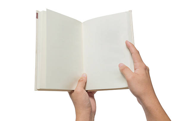 istock Hand holding white book isolated on white 526277024