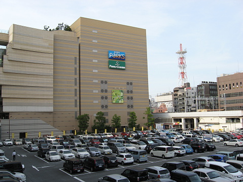 Osaka, Japan - June 1, 2015: Undefined car parking at the outdoor public carpark in Namba Park Mall.